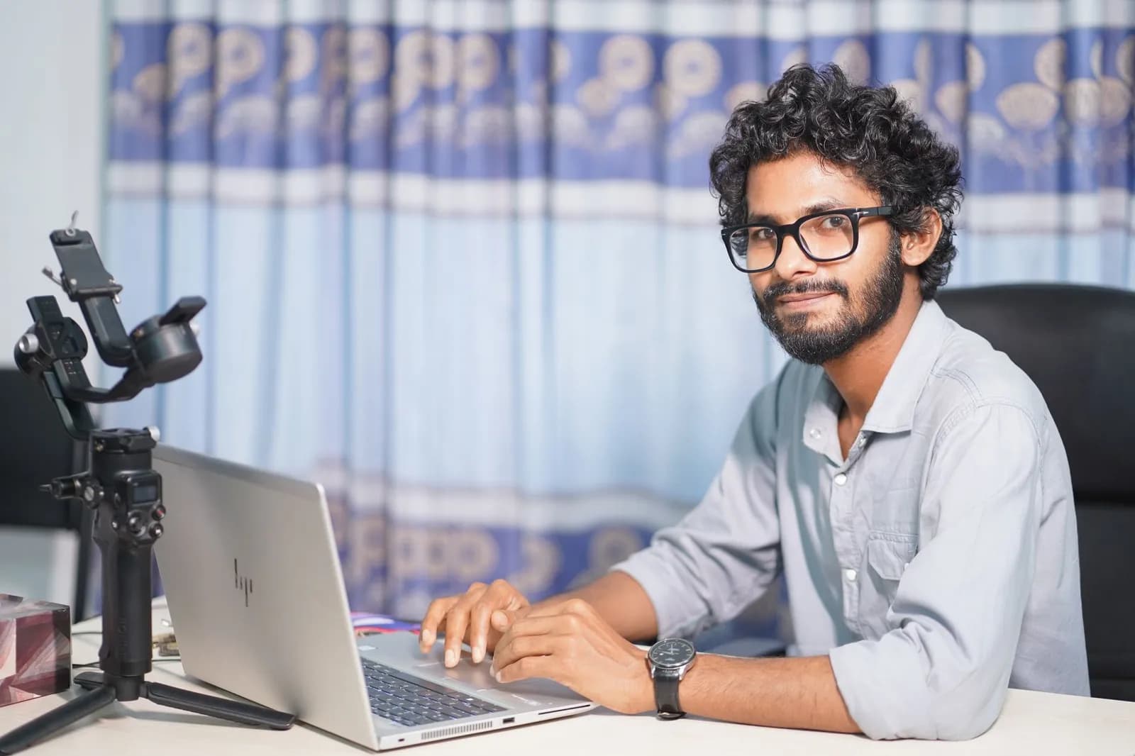 GoHighLevel landing page builder: a marketer designing a page on a laptop