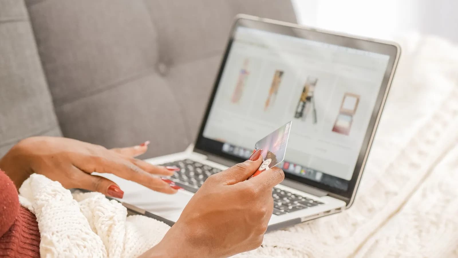 A smartphone with a shopping cart depicting the concept of online shopping in a colorful studio setup.