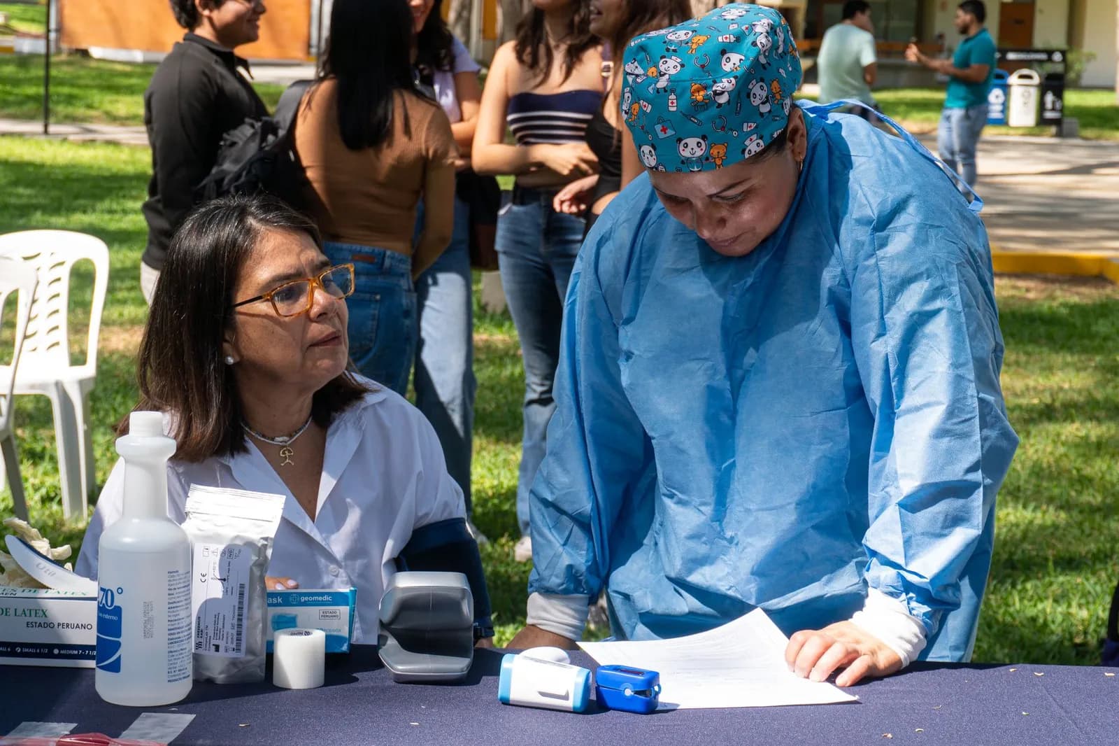 Healthcare community marketing: staff talking with residents at a local health fair
