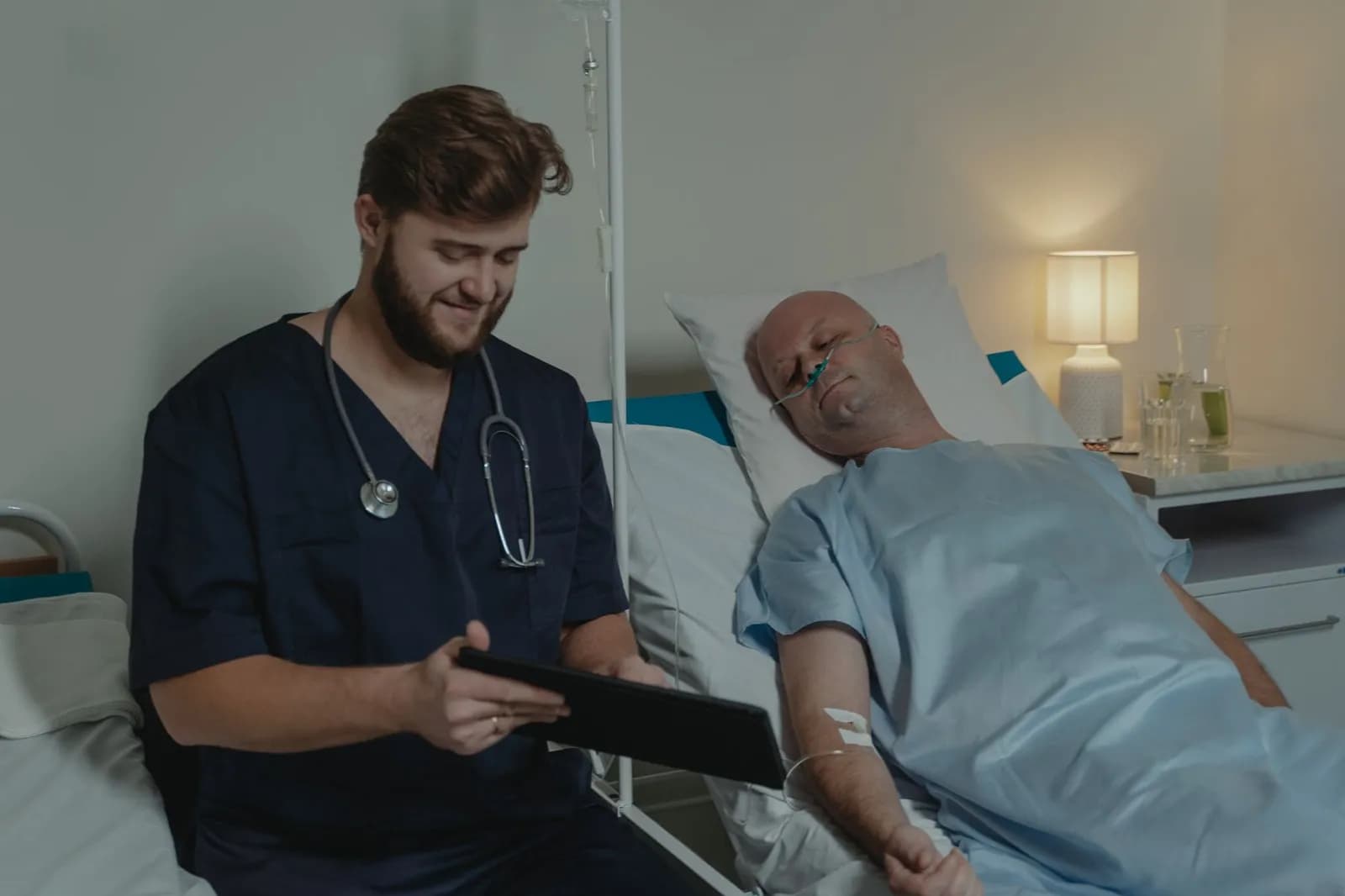 Healthcare software development trends: a doctor using a tablet in a hospital corridor