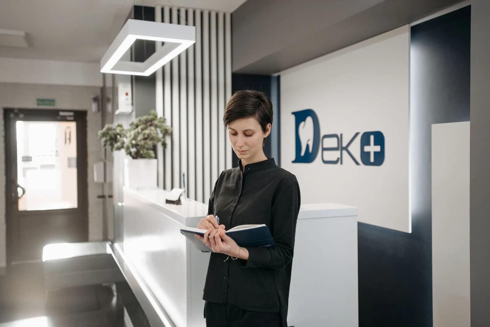 Patient journey mapping for a clinic: a receptionist welcoming a patient at the front desk