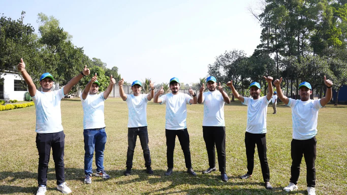 Team cheering together on the lawn