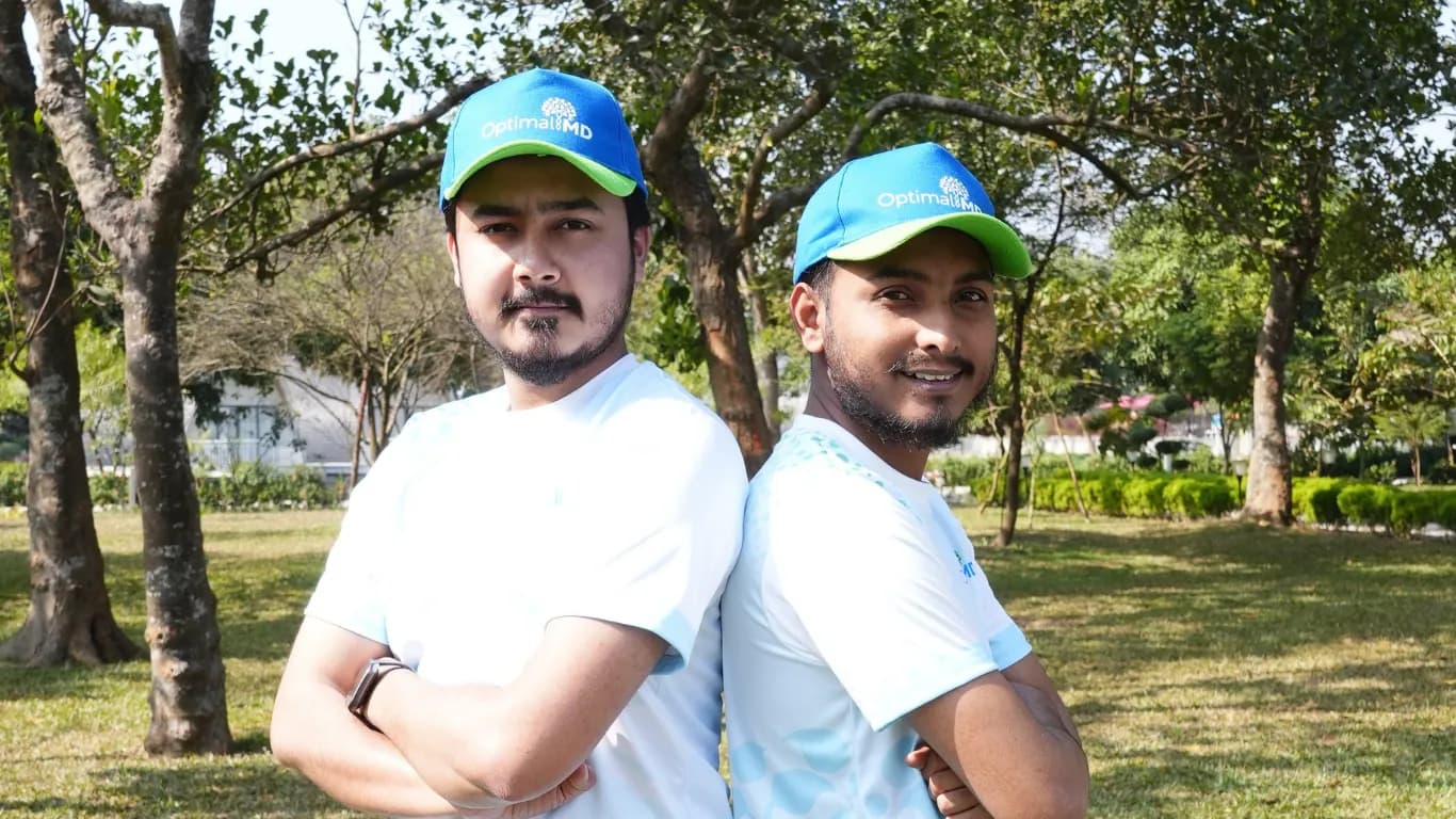 Two team members posing in the park