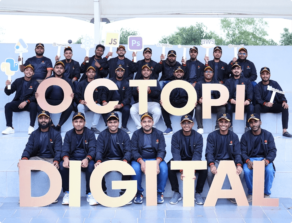 The Octopi Digital team holding letters spelling OCTOPI DIGITAL