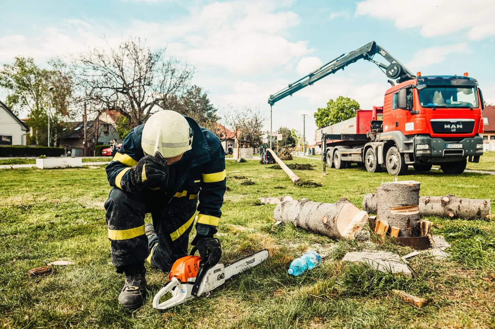 Emergency tree service marketing: an arborist crew clearing a storm-fallen tree