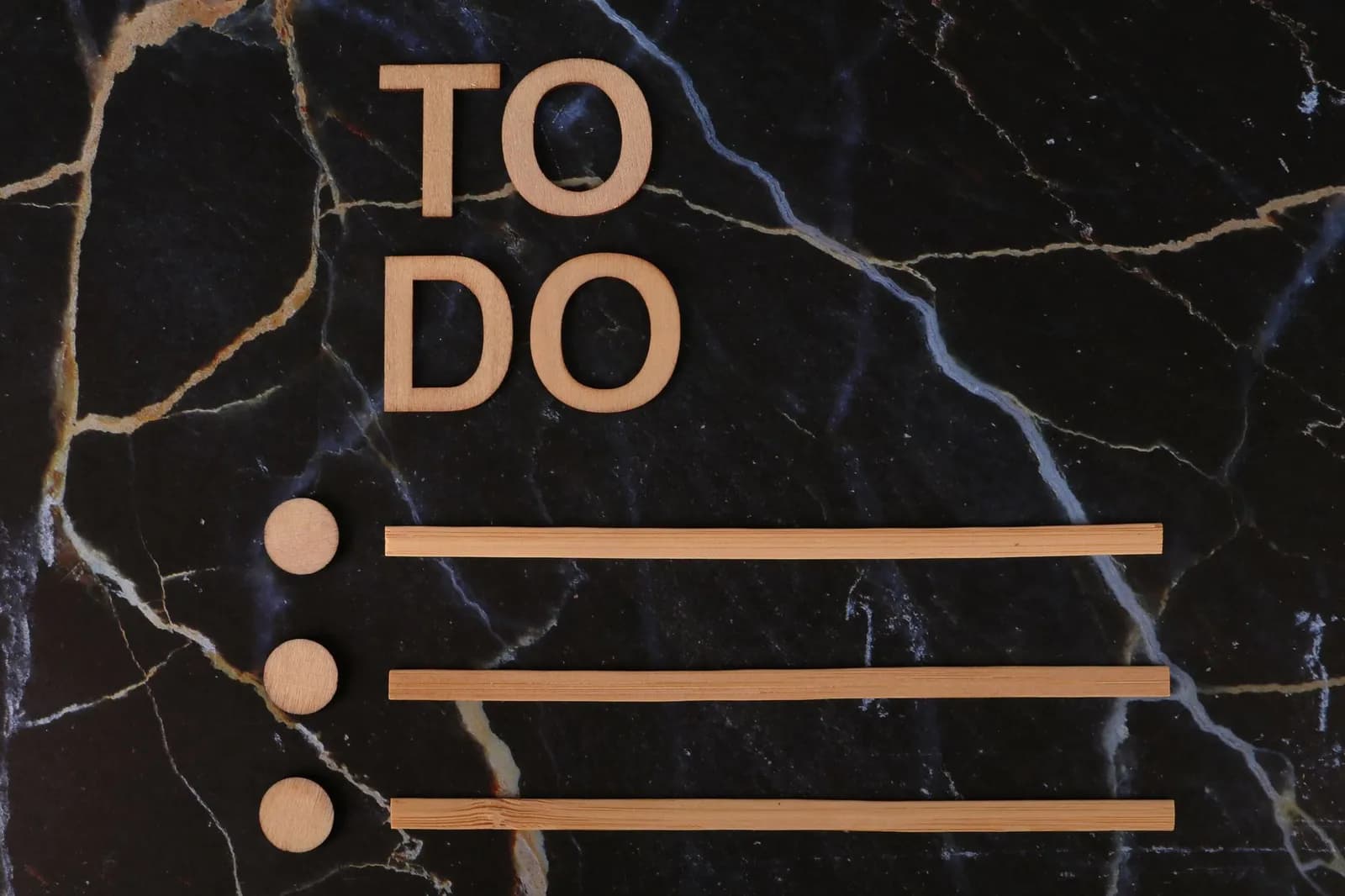 Wooden 'To Do' list design on dark marble background, perfect for productivity themes.
