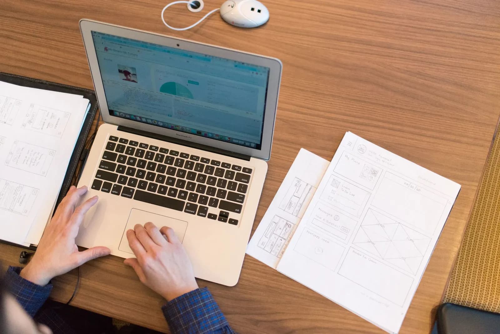 GoHighLevel landing page builder: a marketer designing a page on a laptop