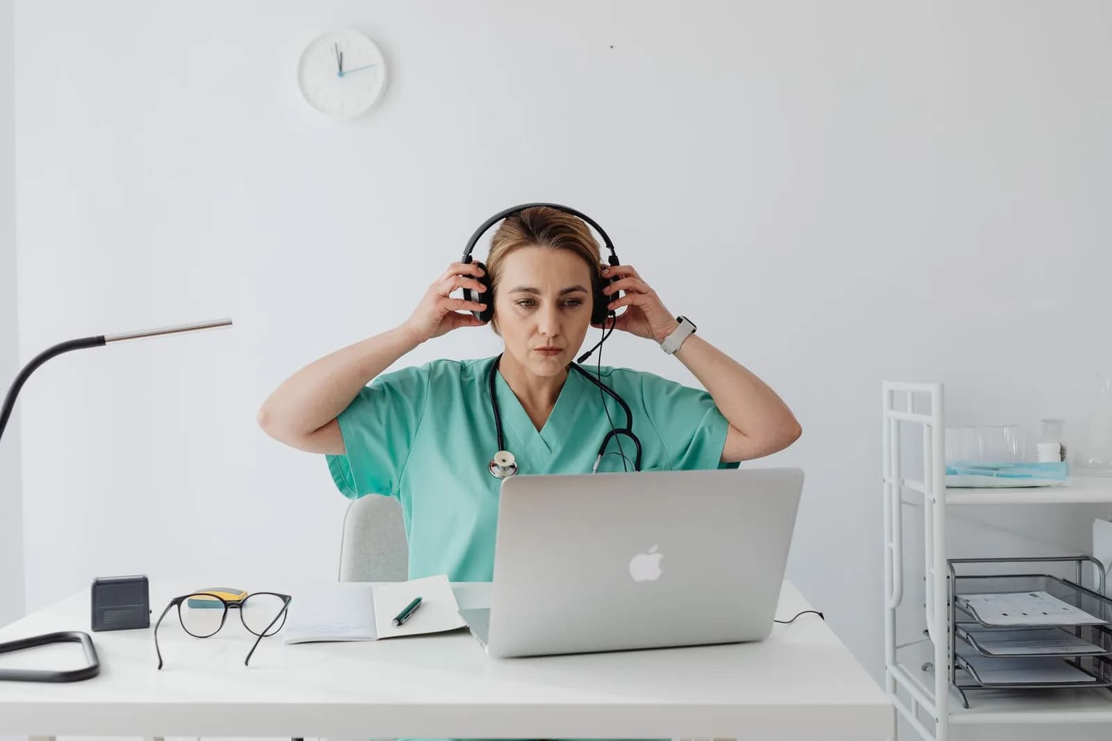 Healthcare data privacy marketing: a clinic receptionist working at a computer
