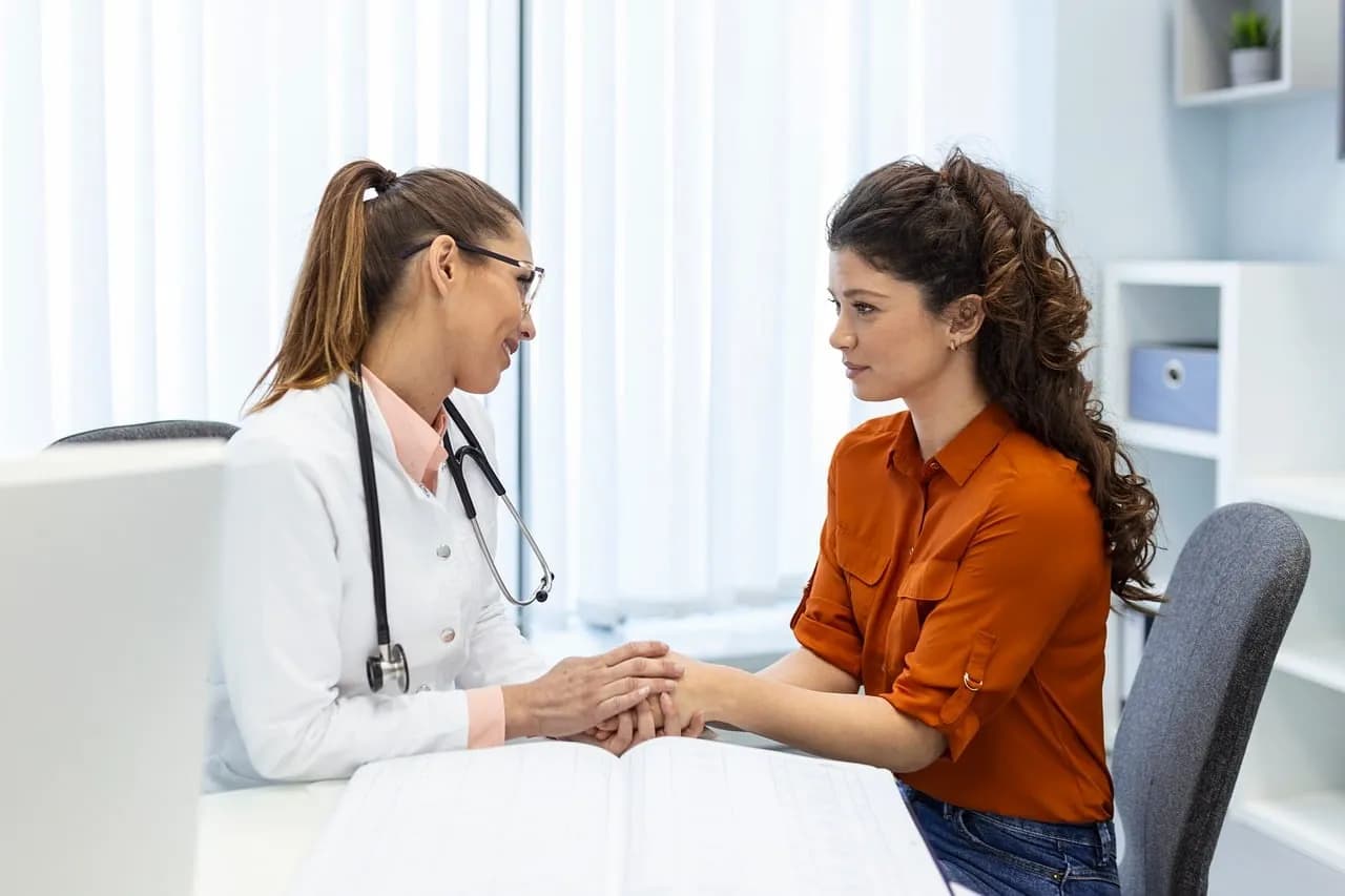 Patient engagement strategies in practice: a doctor talking with a patient in a clinic