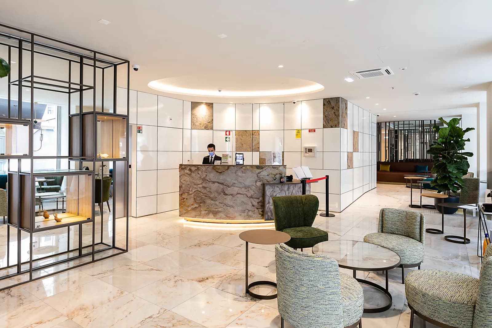 Contemporary hotel facade featuring minimalist design and geometric window patterns.