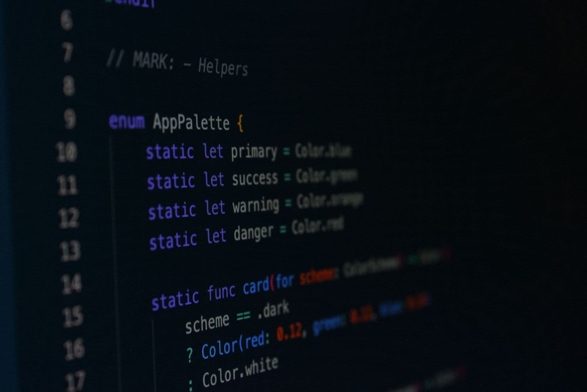 Macro photography of color palette code in a programming environment.