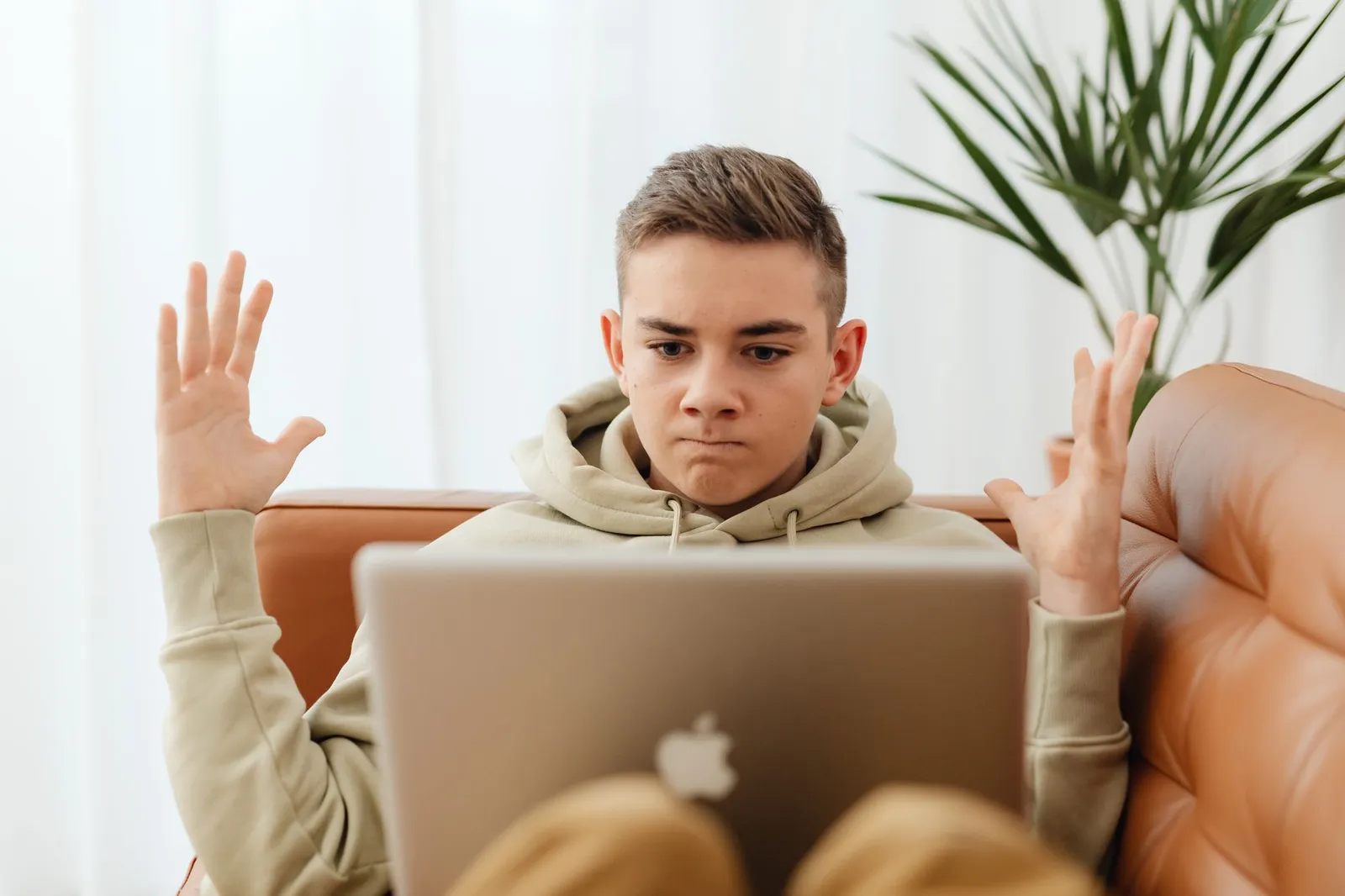 Close-up of a hand holding a paper plane with 