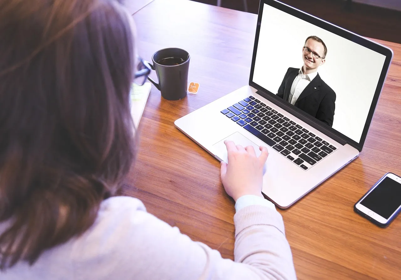 GoHighLevel community features used to host an online event on a laptop