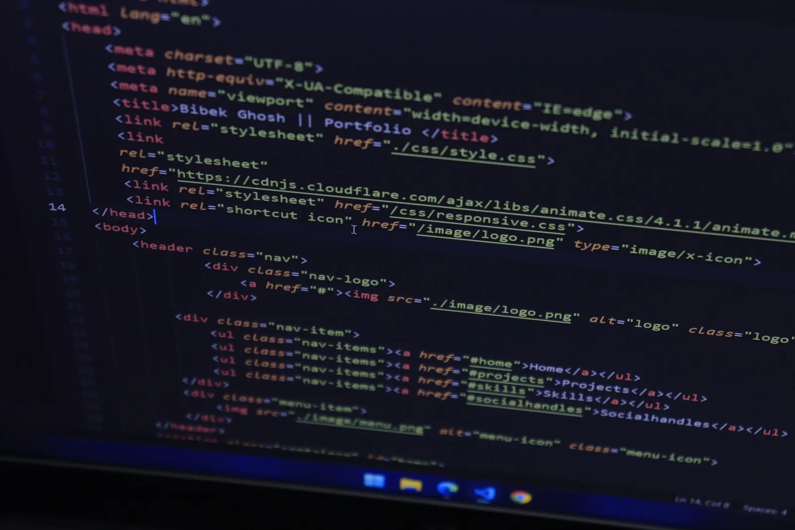 High-resolution close-up of HTML code displayed on a computer screen, perfect for technology themes.