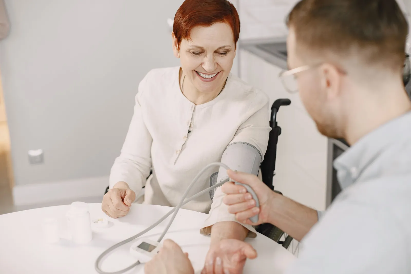 Healthcare community marketing in practice: a nurse checking a resident's blood pressure at a community event