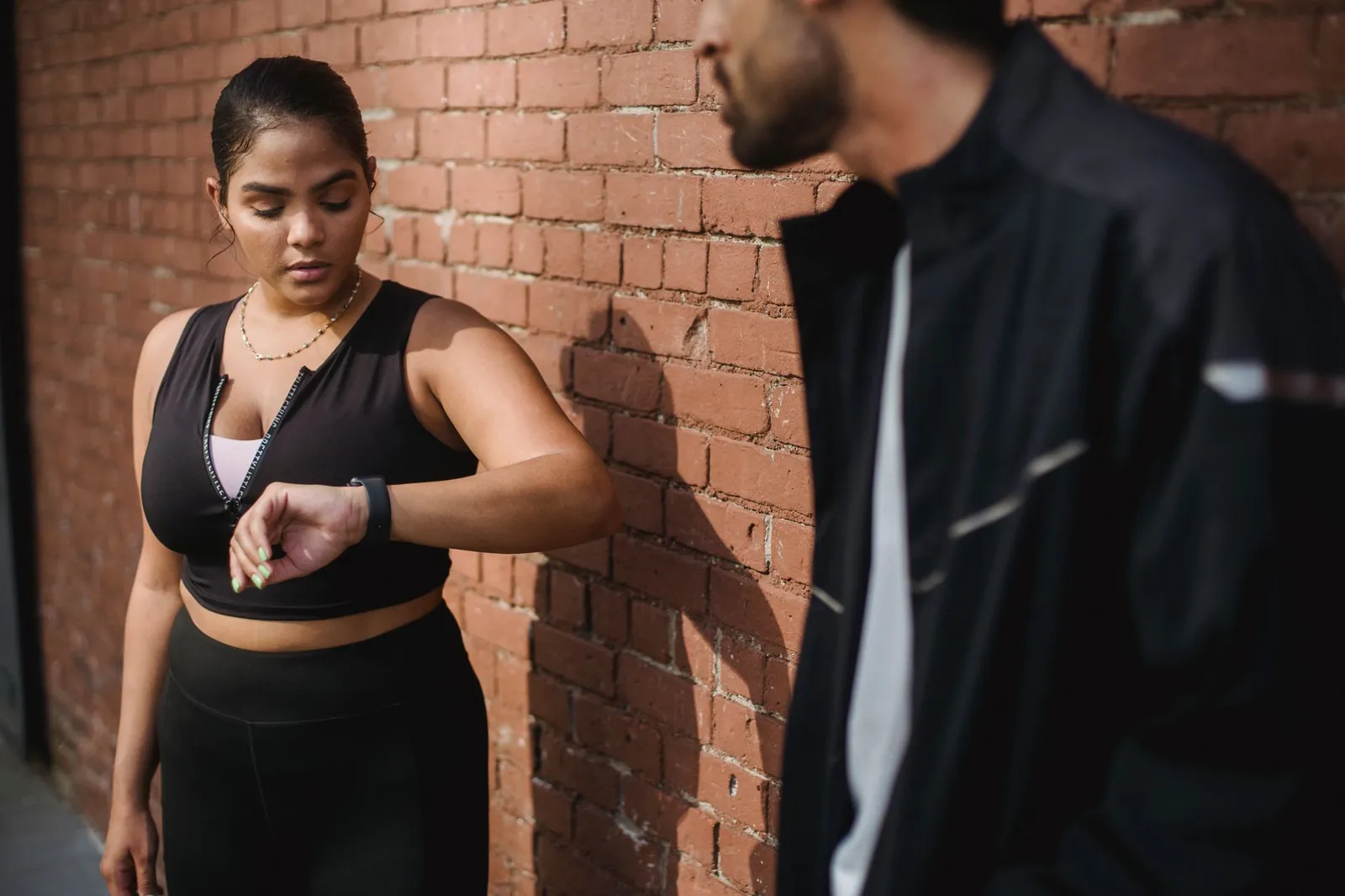 Healthcare gamification software for activity goals: a person walking with a fitness tracker