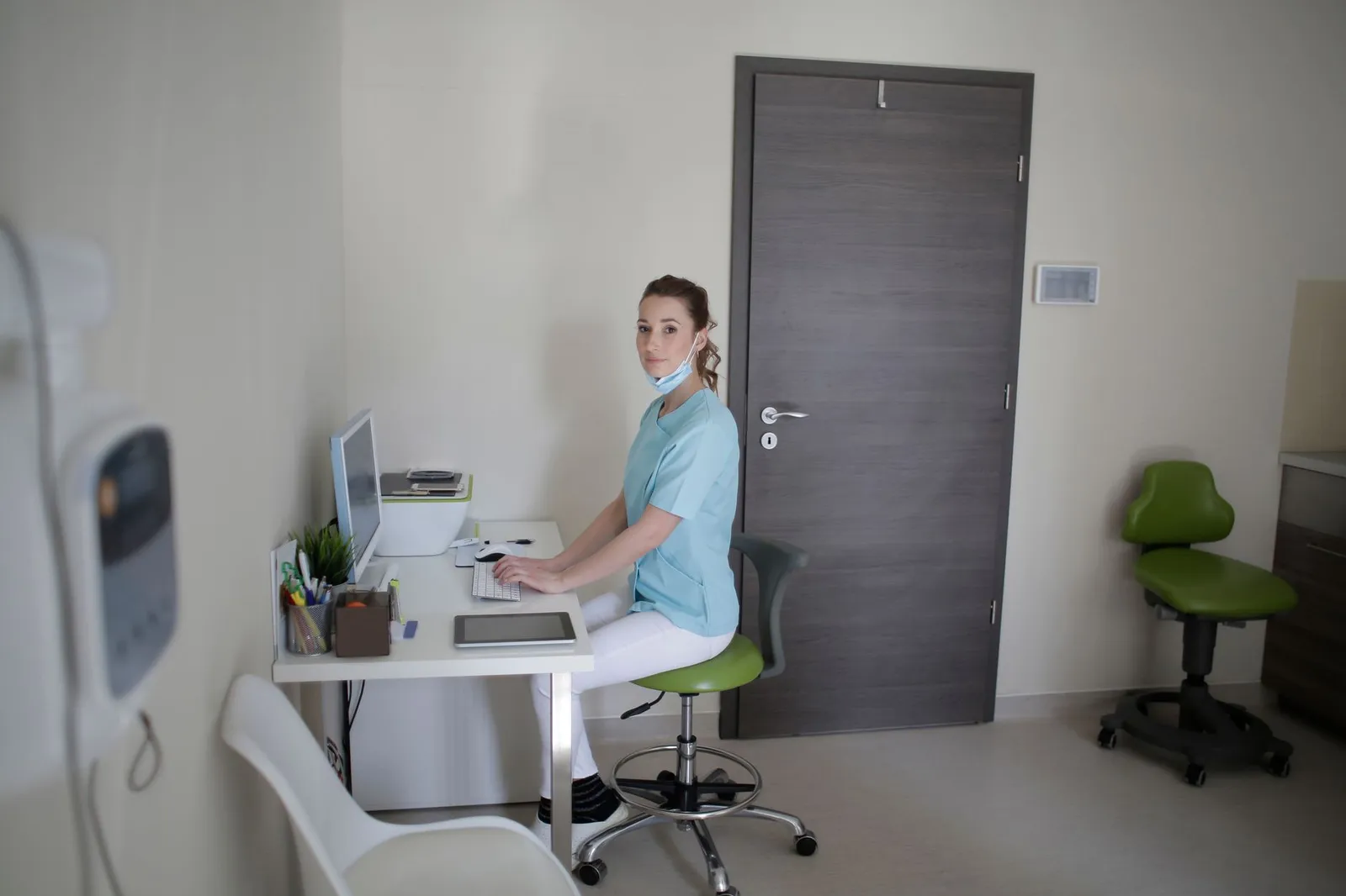 Healthcare RCM software development in practice: clinic staff checking claim data on a computer