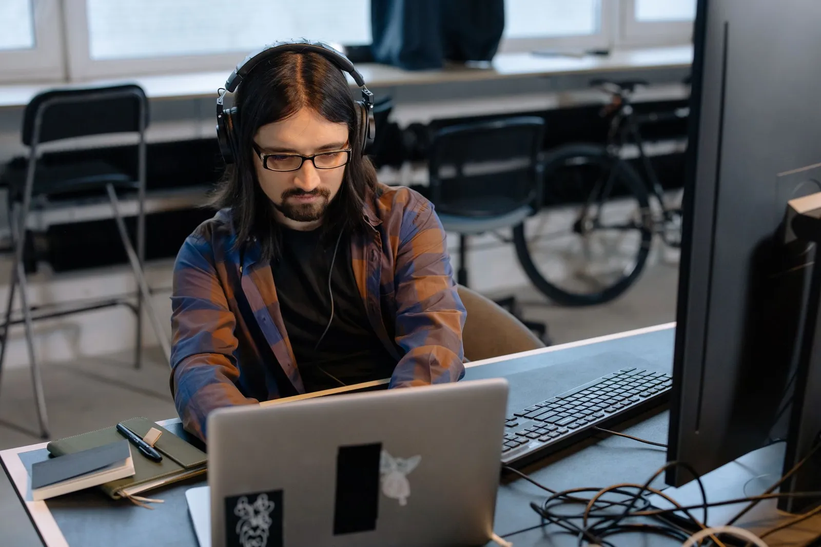 Mental health app development team reviewing an app design on a laptop