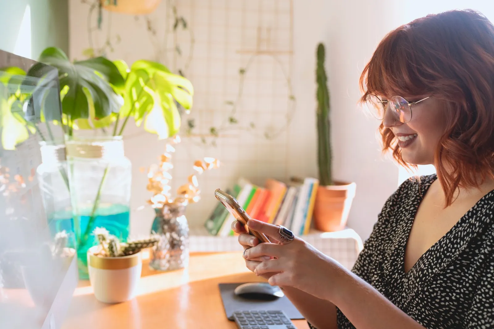 Tree care industry marketing trends: a homeowner reading reviews on a phone